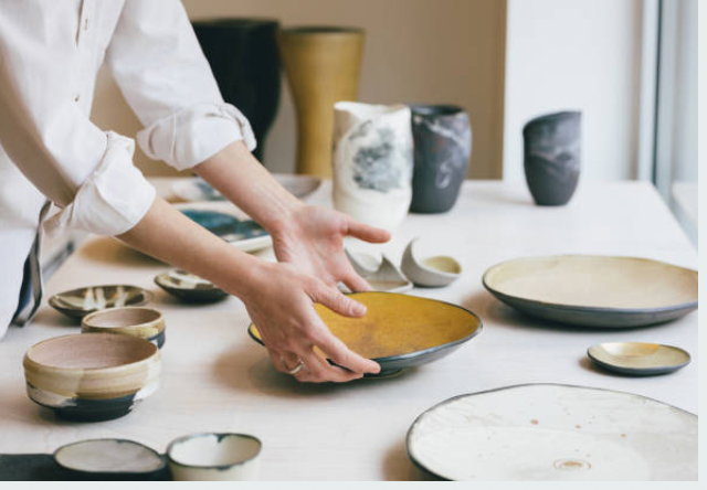 students crafting and glazing custom dinnerware set in pottery workshop