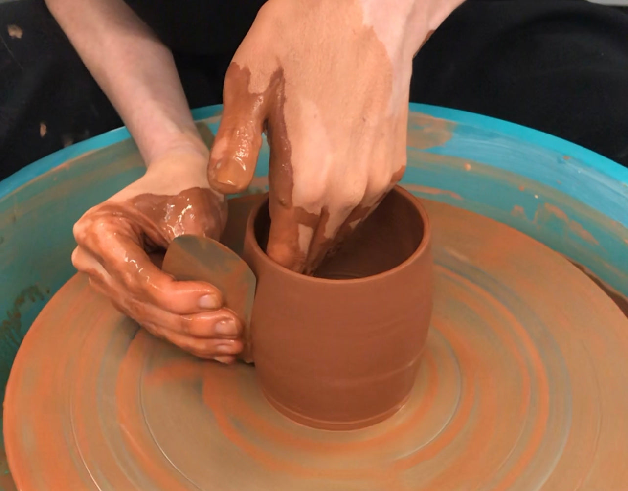 Clay throwing on wheel